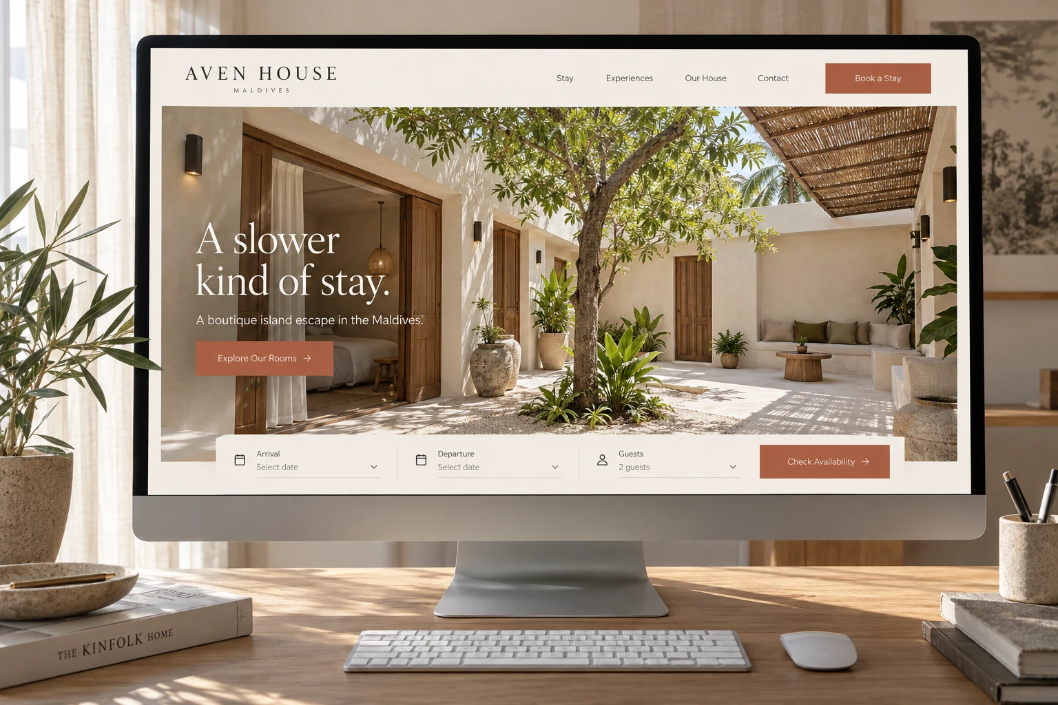 The Aven House home page on a desktop screen shows “A slower kind of stay.” over a sunlit courtyard and tree, with a booking bar below.