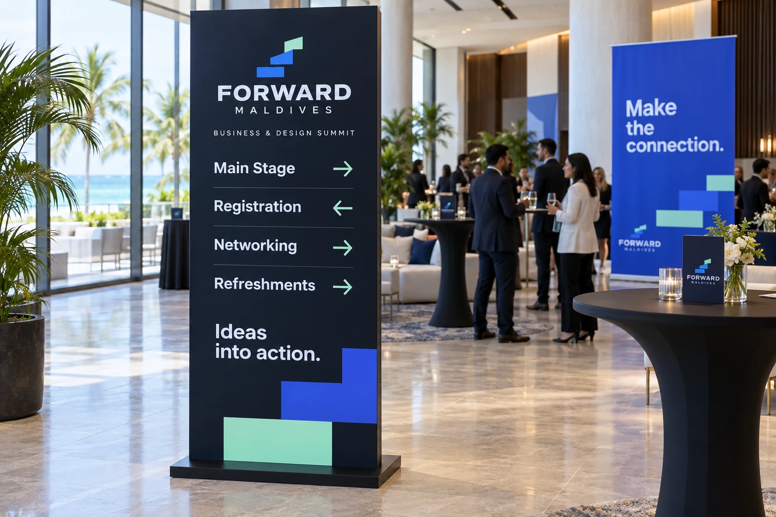 A navy Forward Maldives wayfinding totem points to Main Stage, Registration, Networking and Refreshments in a sunlit lobby, with a blue “Make the connection.” banner behind.