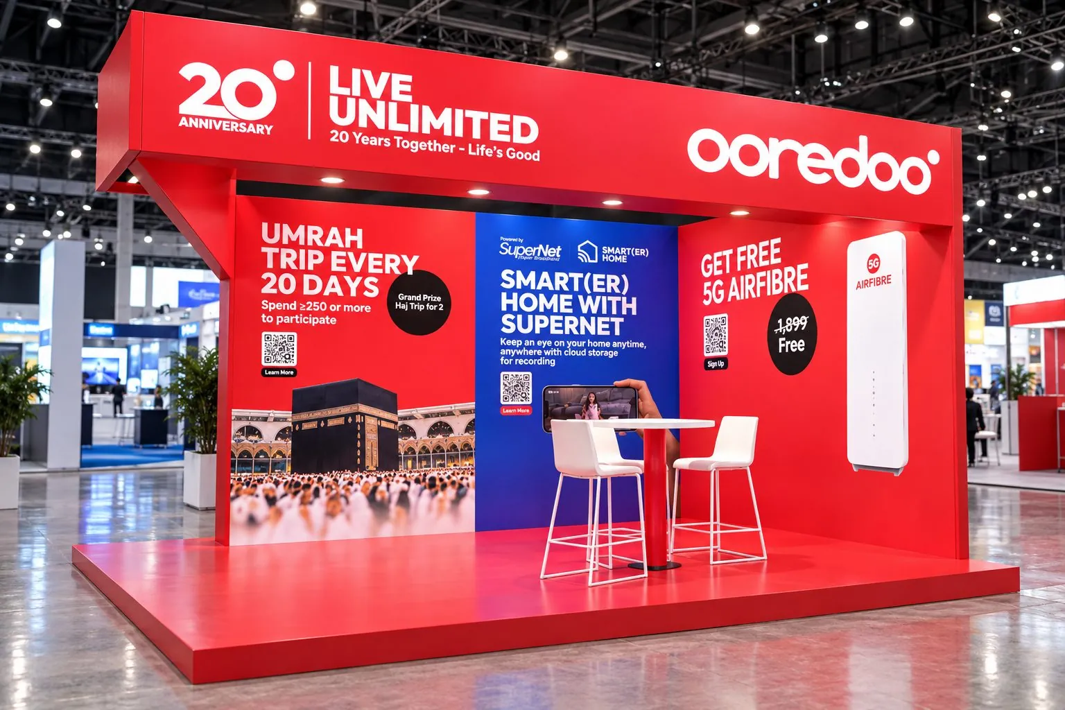 Red Ooredoo 20th anniversary expo stand, “Live Unlimited”, with offer panels, a router display and a high table.