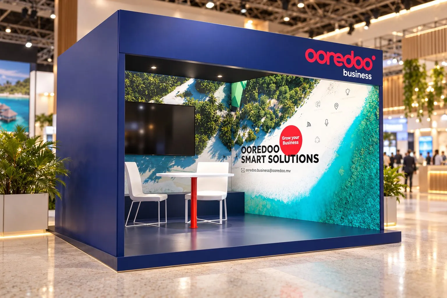 Navy Ooredoo Business expo stand, “Smart Solutions”, with an aerial island mural, a screen and a meeting table.