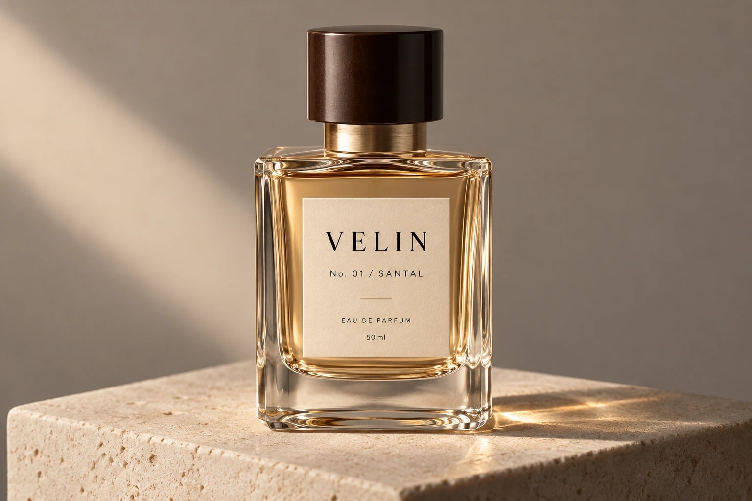 A square Velin bottle with a dark wood cap and a cream label reading “No. 01 / SANTAL”, on a limestone block in warm side light.