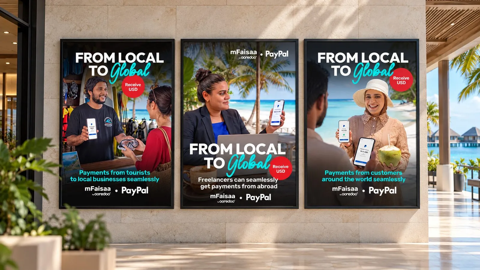 Three mFaisaa × PayPal posters, “From local to global”, mounted on a wall along a resort walkway.